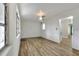 Neutral bedroom with hardwood floors, a ceiling fan and natural light at 215 W Valencia St, Lakeland, FL 33805