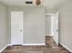 A neutral bedroom provides laminate floors, closet space, and fresh paint at 215 W Valencia St, Lakeland, FL 33805