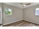 This bedroom offers natural light with vinyl floors, and a neutral color palette providing a serene living space at 215 W Valencia St, Lakeland, FL 33805