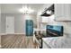 Bright kitchen featuring white cabinets, stainless steel appliances, and a breakfast bar at 215 W Valencia St, Lakeland, FL 33805
