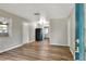 A bright living room with laminate flooring and light-colored walls is move-in ready at 215 W Valencia St, Lakeland, FL 33805