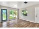 This living room features hardwood floors, natural light, and neutral paint at 215 W Valencia St, Lakeland, FL 33805