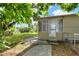 The covered, screened porch is accessible from the backyard via a small patio area at 215 W Valencia St, Lakeland, FL 33805