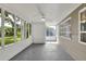 An inviting screened-in porch offers a peaceful spot to enjoy the outdoors at 215 W Valencia St, Lakeland, FL 33805
