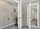 A gray-floored utility area reveals a water heater installation and convenient access to the home's hallway at 215 W Valencia St, Lakeland, FL 33805