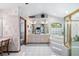 Spacious bathroom with a double vanity, soaking tub, and a separate glass-enclosed shower at 2208 Deerbrook Dr, Lakeland, FL 33811