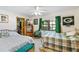 Bedroom with two beds, ceiling fan, natural light from the window and walk-in closet at 2208 Deerbrook Dr, Lakeland, FL 33811