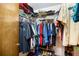 Organized walk-in closet with shelves and hanging rods, providing ample storage space at 2208 Deerbrook Dr, Lakeland, FL 33811