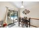 Bright dining area with table and view of screened lanai and pool at 2208 Deerbrook Dr, Lakeland, FL 33811