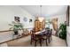 Charming dining room featuring a chandelier, hardwood table with seating for six and natural light at 2208 Deerbrook Dr, Lakeland, FL 33811