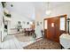 Inviting foyer with a chandelier, a wooden front door and tile flooring at 2208 Deerbrook Dr, Lakeland, FL 33811