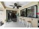Covered outdoor seating area with bar and view to kitchen at 2208 Deerbrook Dr, Lakeland, FL 33811