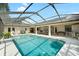 View of large pool area with screened enclosure and patio at 2208 Deerbrook Dr, Lakeland, FL 33811