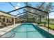 View of pool with screened enclosure, lanai and yard at 2208 Deerbrook Dr, Lakeland, FL 33811