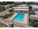 Aerial view of the community pool, surrounded by lush landscaping and seating areas at 2219 Starboard Rd, Winter Haven, FL 33881
