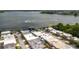 A panoramic aerial view showcases a community alongside a serene lake with boat docks at 2219 Starboard Rd, Winter Haven, FL 33881