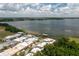 A birds-eye view captures a beautiful lakefront community with a sparkling blue pool at 2219 Starboard Rd, Winter Haven, FL 33881