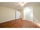 Bedroom with hardwood floors, ceiling fan and ensuite bathroom and doorway at 2219 Starboard Rd, Winter Haven, FL 33881