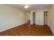 A bright bedroom features wood floors, a ceiling fan, and closet at 2219 Starboard Rd, Winter Haven, FL 33881