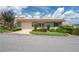 Charming single-story home with a light green exterior, well-manicured lawn and attached garage at 2219 Starboard Rd, Winter Haven, FL 33881