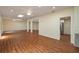 Open-concept kitchen area featuring wood flooring, stainless appliances, and a view to the adjacent living room at 2219 Starboard Rd, Winter Haven, FL 33881