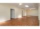 Large open living room with wood flooring, recessed lighting, ceiling fans, and natural light at 2219 Starboard Rd, Winter Haven, FL 33881