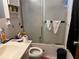 Simple bathroom with standard white tiled shower at 225 W Orange St, Lake Alfred, FL 33850
