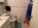 Standard bathroom features white tile, toilet, sink and shower/tub combination at 225 W Orange St, Lake Alfred, FL 33850