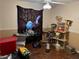 Bedroom with ceiling fan and bonus cat accessories at 225 W Orange St, Lake Alfred, FL 33850