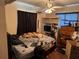 Bedroom with ceiling fan, dark curtains, and fan at 225 W Orange St, Lake Alfred, FL 33850