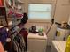 Laundry area includes shelving, washer, and dryer hook-ups at 225 W Orange St, Lake Alfred, FL 33850