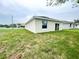 The home's backyard features well-maintained grass and backyard exterior at 2521 Sunset Dr, Winter Haven, FL 33881