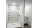 Bright bathroom with a well-lit shower and modern fixtures at 2521 Sunset Dr, Winter Haven, FL 33881