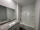 Modern bathroom design with granite countertops and bathtub at 2521 Sunset Dr, Winter Haven, FL 33881