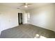 Carpeted bedroom showcasing an open doorway leading to other rooms in the house at 2521 Sunset Dr, Winter Haven, FL 33881