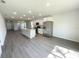Well-lit kitchen featuring a center island with white cabinets and modern appliances at 2521 Sunset Dr, Winter Haven, FL 33881
