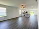 Open-concept kitchen with white cabinets, stainless steel appliances, and center island at 2521 Sunset Dr, Winter Haven, FL 33881