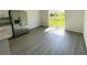 Modern kitchen featuring stainless steel refrigerator and sliding glass doors leading to the backyard at 2521 Sunset Dr, Winter Haven, FL 33881
