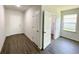 Bright room with wood-look floors, white walls, and windows at 2521 Sunset Dr, Winter Haven, FL 33881