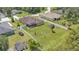 Aerial view of the property with fenced backyard, screened lanai, and mature landscaping at 2932 Blackwater Oaks Dr, Mulberry, FL 33860
