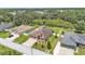 Aerial view showcasing a fenced in backyard and lush green surroundings at 2932 Blackwater Oaks Dr, Mulberry, FL 33860