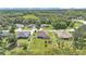 A birds eye view of the home, backyard, and mature trees in a residential neighborhood at 2932 Blackwater Oaks Dr, Mulberry, FL 33860