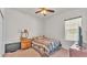 Comfortable bedroom features a ceiling fan and natural light, creating a cozy and inviting atmosphere at 2932 Blackwater Oaks Dr, Mulberry, FL 33860