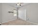 A neutral toned bedroom with a ceiling fan, carpet floors, closet and window at 2932 Blackwater Oaks Dr, Mulberry, FL 33860