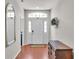 Inviting foyer with hardwood floors, elegant furnishings, and natural light at 2932 Blackwater Oaks Dr, Mulberry, FL 33860