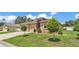 Lovely home with a well-maintained lawn, mature trees, and a two-car garage at 2932 Blackwater Oaks Dr, Mulberry, FL 33860