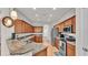 Spacious kitchen with wood cabinets, granite counters, stainless steel appliances, and ample storage at 2932 Blackwater Oaks Dr, Mulberry, FL 33860