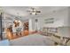 Open-concept living area with a comfortable sofa set, leading into dining and kitchen spaces at 2932 Blackwater Oaks Dr, Mulberry, FL 33860