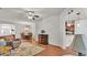 Open living room features hardwood floors, ceiling fan, dining set, decor and an open floor plan at 2932 Blackwater Oaks Dr, Mulberry, FL 33860