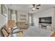 Bright living room featuring plush carpeting, neutral decor, and a comfortable reclining sofa set at 2932 Blackwater Oaks Dr, Mulberry, FL 33860